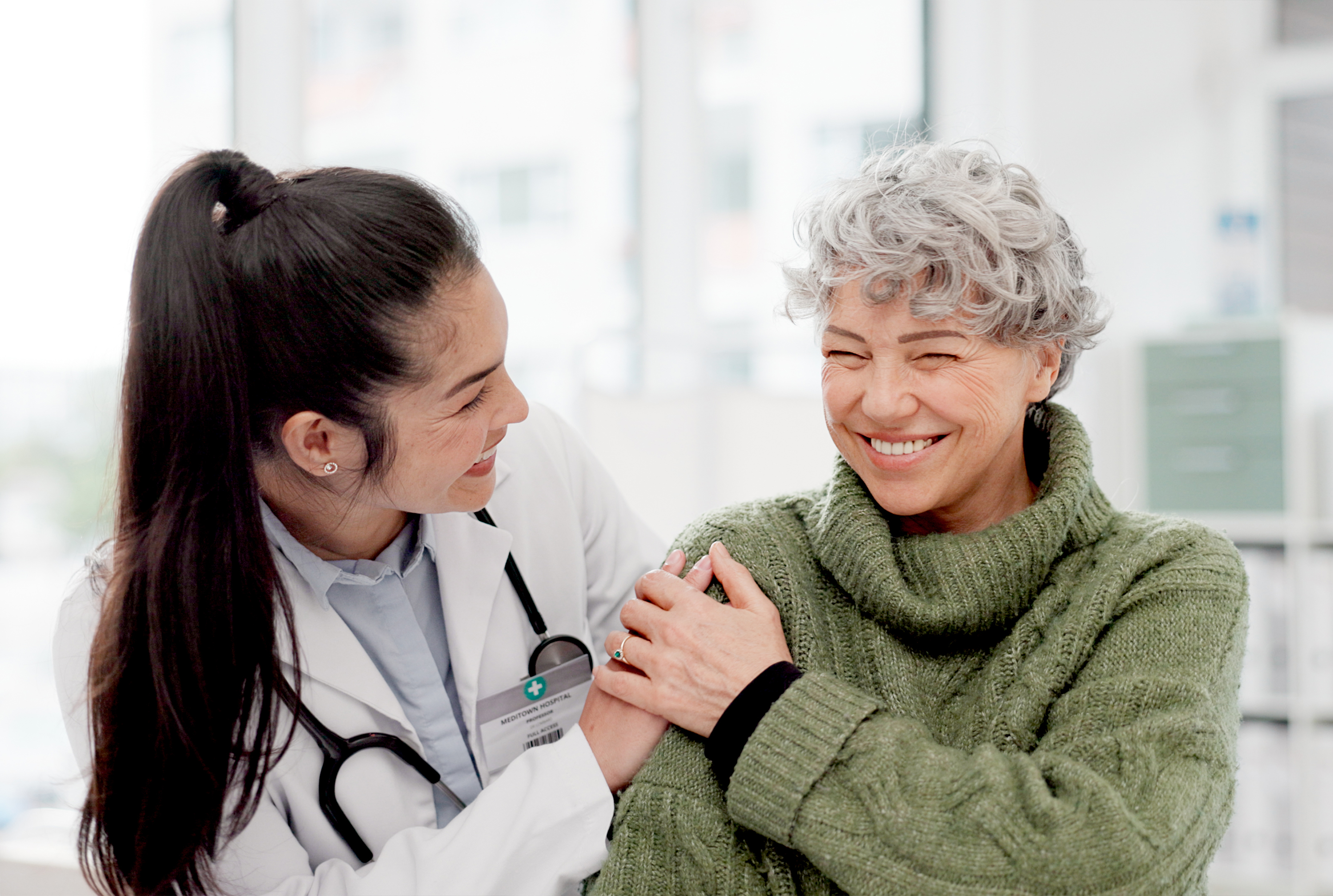 A doctor smiling with a patient